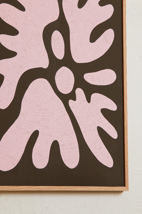 Art print featuring a minimalistic motif in chocolate brown and pastel pink, with shapes that explore the space between abstraction and recognition through soft, fluid forms. Styled in a minimalist interior.