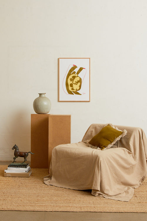 Art print with an abstract illustration of a softly shaped silhouette jumping rope. Grainy texture, hand-drawn lines, and warm ochre and sand tones meet graphic red accents. Styled in a minimalist interior.