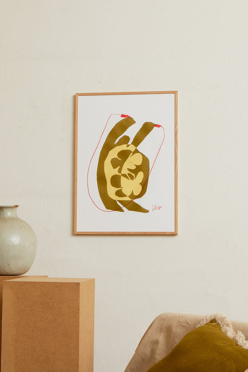 Art print with an abstract illustration of a softly shaped silhouette jumping rope. Grainy texture, hand-drawn lines, and warm ochre and sand tones meet graphic red accents. Styled in a minimalist interior.