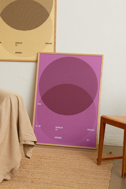 Art print with a graphic illustration of circular forms built from overlapping lines, complemented by small text elements, in purple and blue RAL colors. Styled in a minimalist interior.