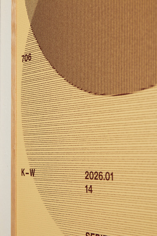 Art print with a graphic illustration of circular forms built from overlapping lines, complemented by small text elements, in brown, red, and beige RAL colors. Styled in a minimalist interior.