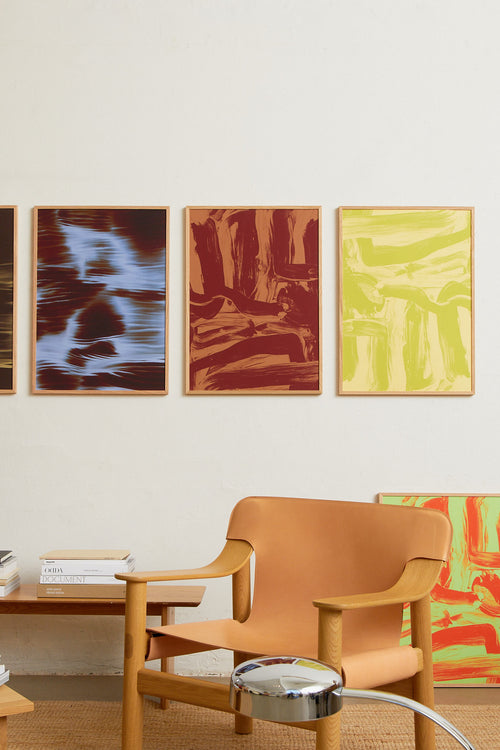 Art print featuring layered and sweeping brushstrokes in two shades of brown that create a sense of movement and tension across the surface. Styled in a minimalist interior.