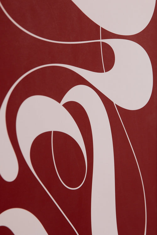 Art print featuring exploratory organic forms emerging in red and pink. Styled in a minimalist interior.