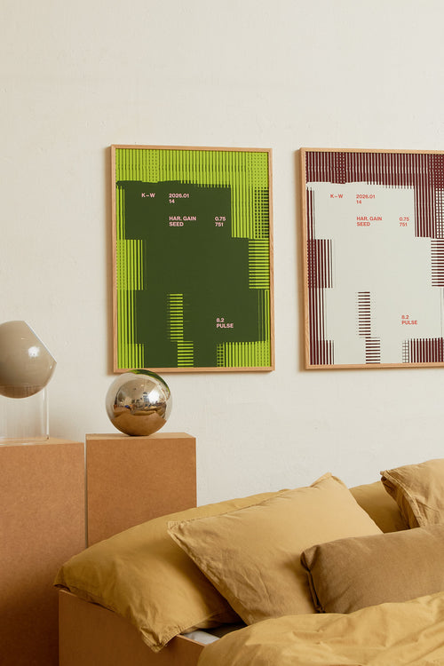 Art print with a graphic illustration of rectangular fields and linear patterns, combined with small text elements, in green and pink RAL colors. Styled in a minimalist interior.