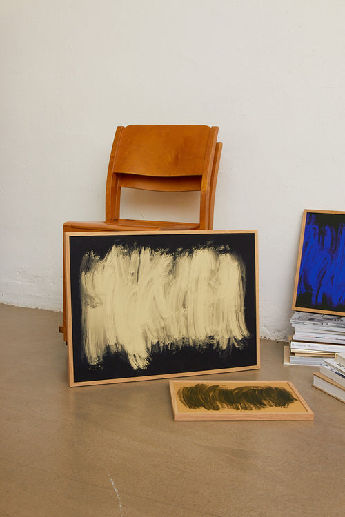 Abstract art piece with a large beige brushstroke on a black background