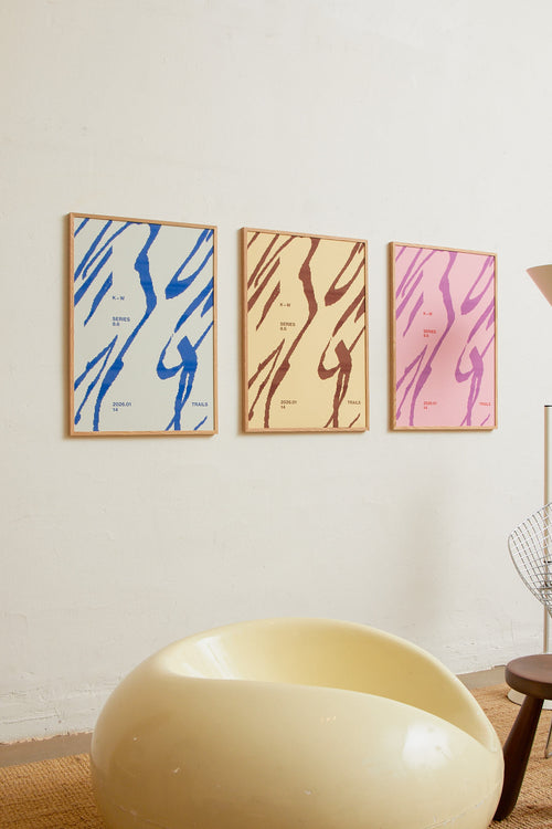 Art print with a graphic illustration of sweeping, organic forms built from dense lines, complemented by small text elements, in pink and purple RAL colors. Styled in a minimalist interior.