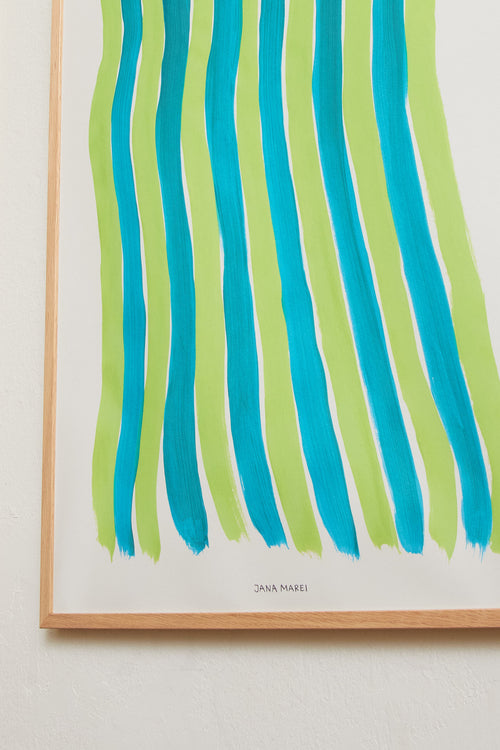 Green striped art print framed and displayed on a light wall