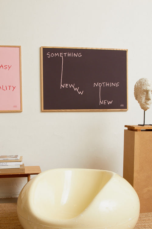 Art print featuring pink handwritten lettering that connects words in an illustrative way on a brown background, creating a new context. Styled in a minimalist interior.