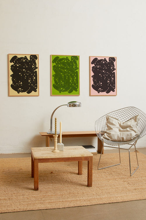 Art print featuring dense, rounded forms in two shades of green with a smooth, glossy feeling. Styled in a minimalist interior.