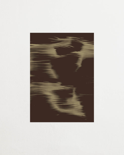 Art print featuring soft, blurred contours and flowing soft beige shapes emerging against a dark brown surface, creating an impression of motion and impermanence. Featured against a light background.